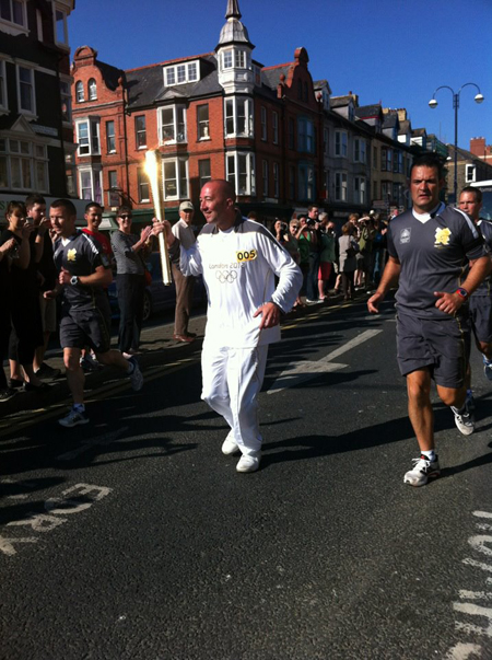Lee Coulson carrying the Olympic Torch